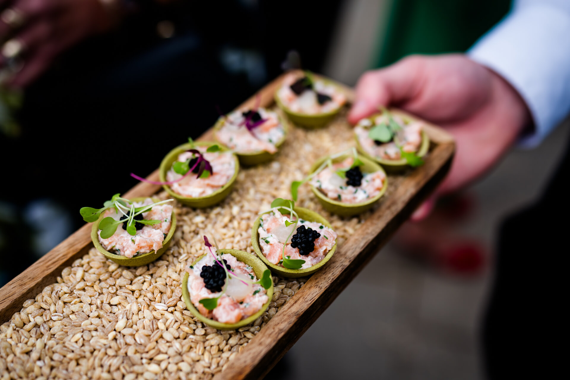 Gourmet appetizers with black caviar and salmon served