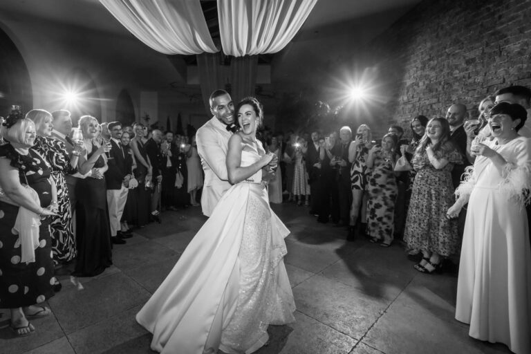 Bride and groom dancing at wedding reception.