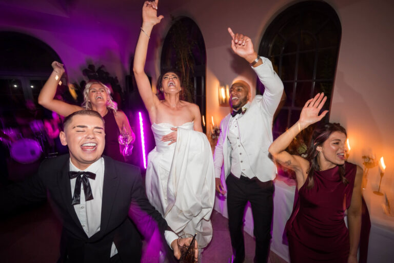 Group enjoying a lively wedding celebration