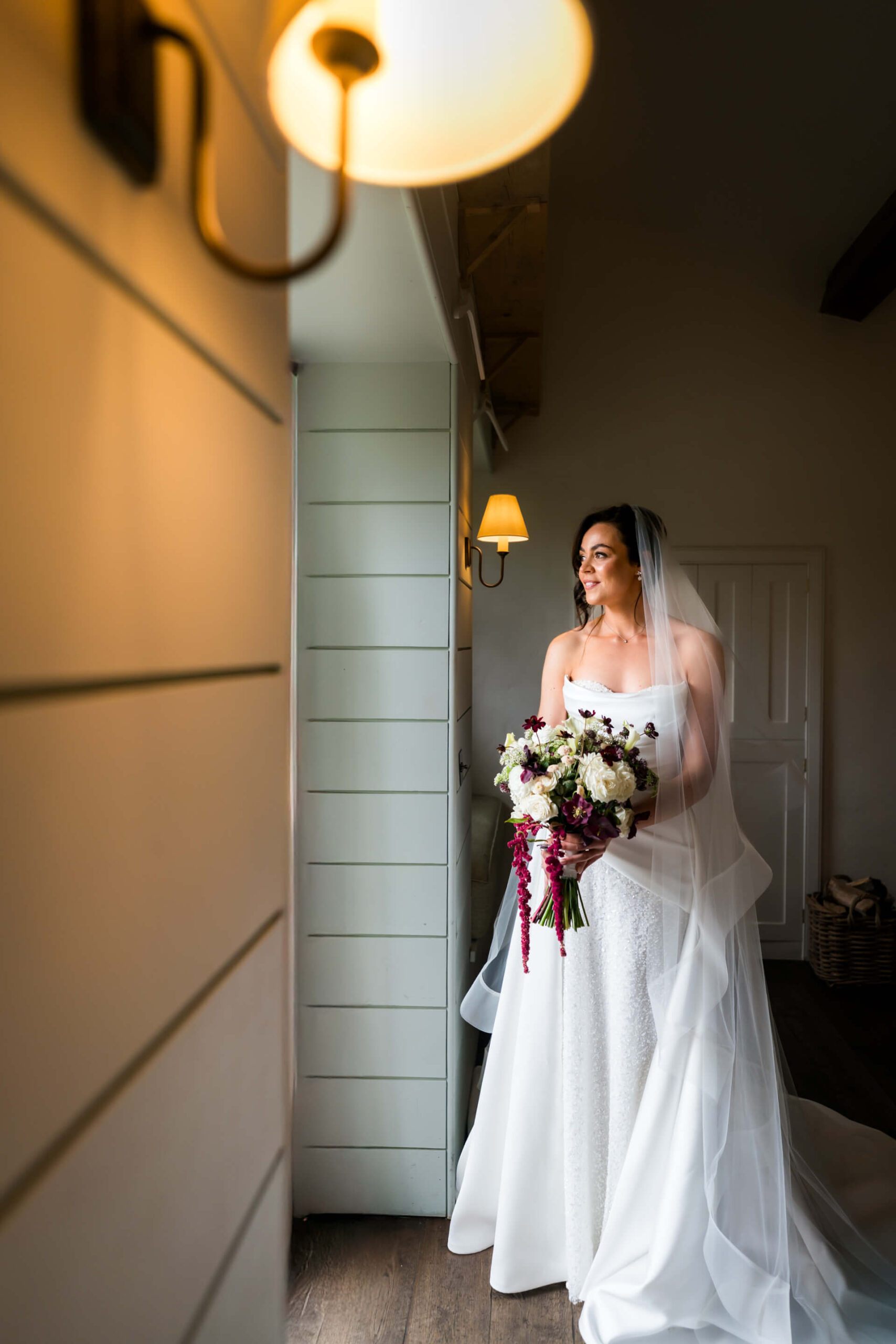 Bride in white dress holding floral bouquet