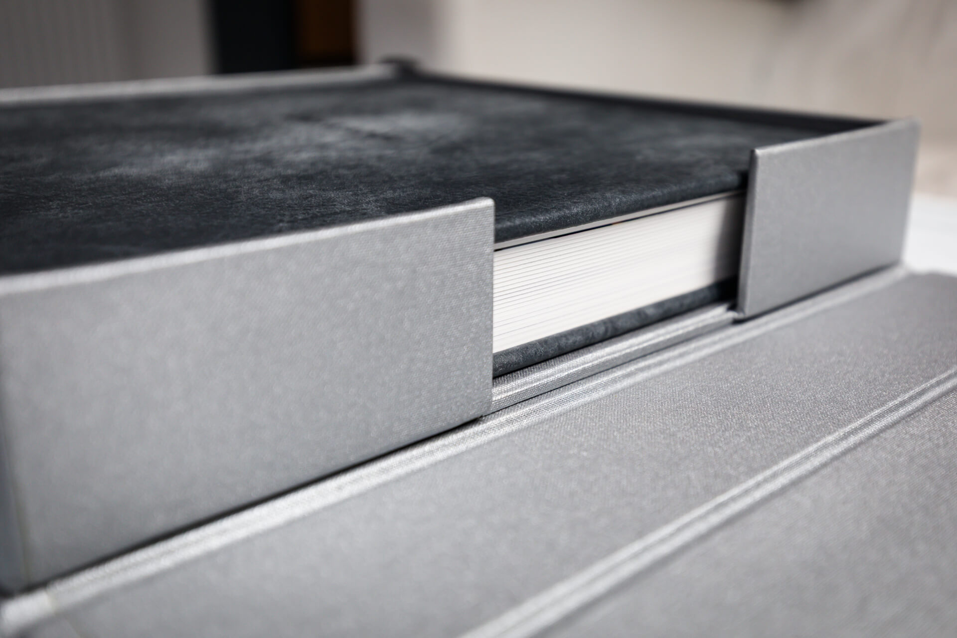 Grey photo album with protective slipcase.