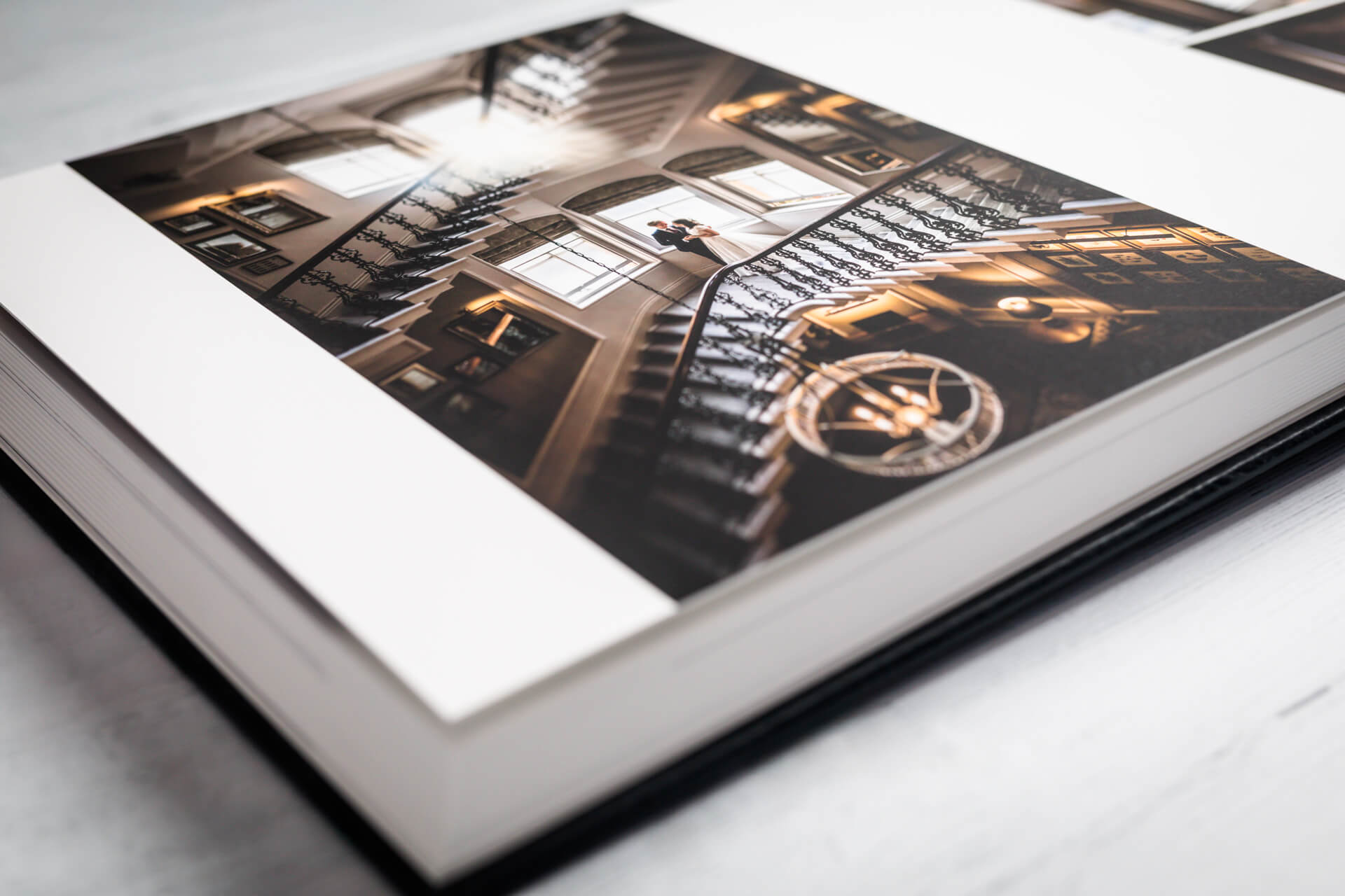 Wedding photo album with spiral staircase image