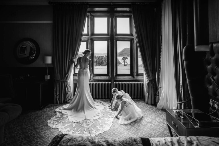 Bride in elegant dress, preparing by window