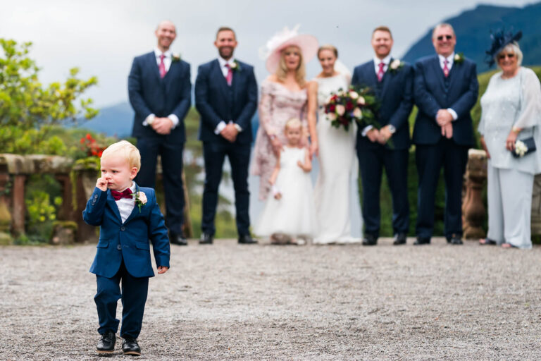 Wedding party with child in foreground